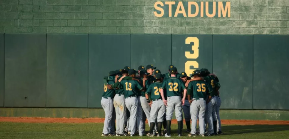 baseball players huddling