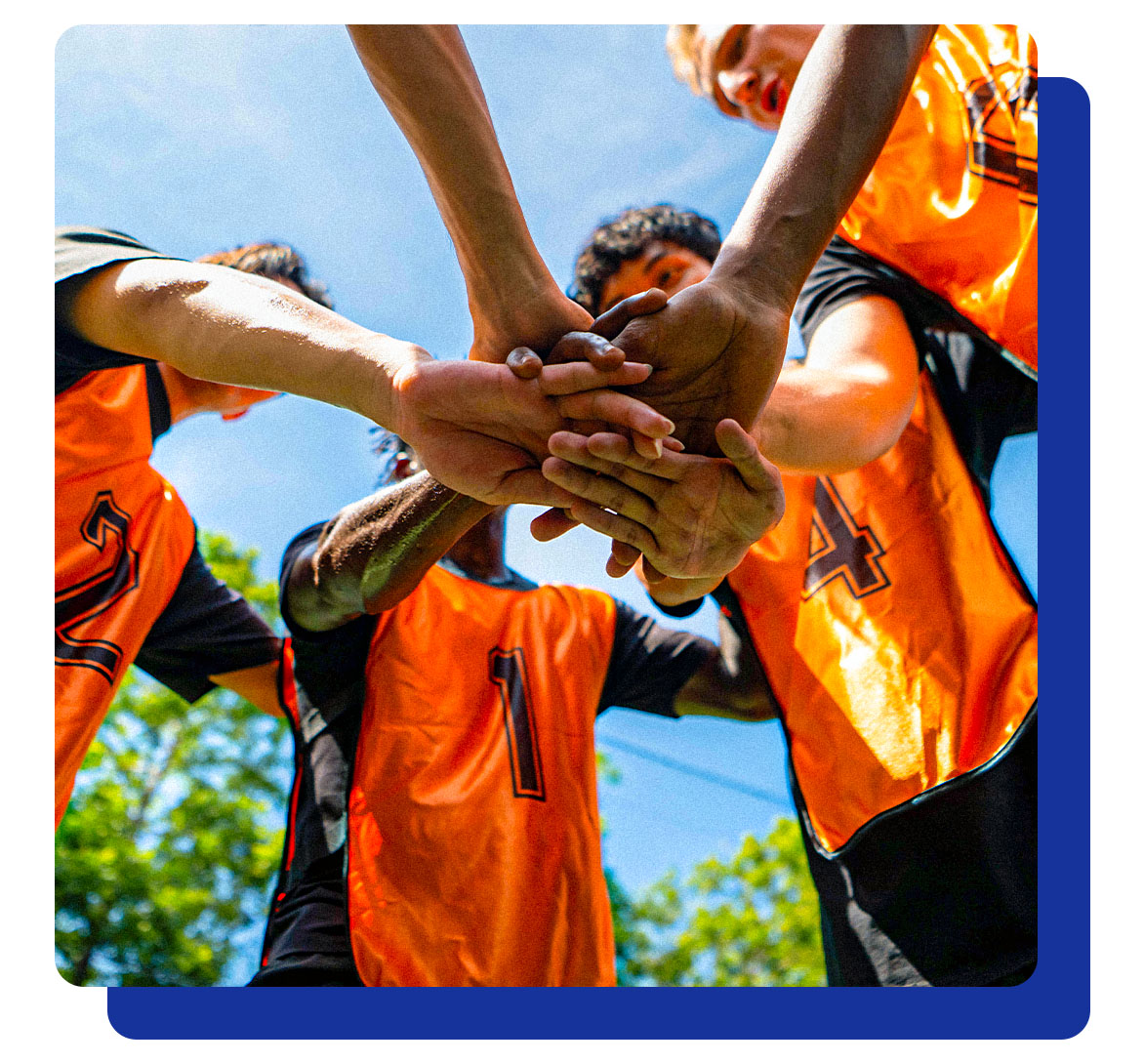 Partnership_Page-2 Photograph of a team huddle