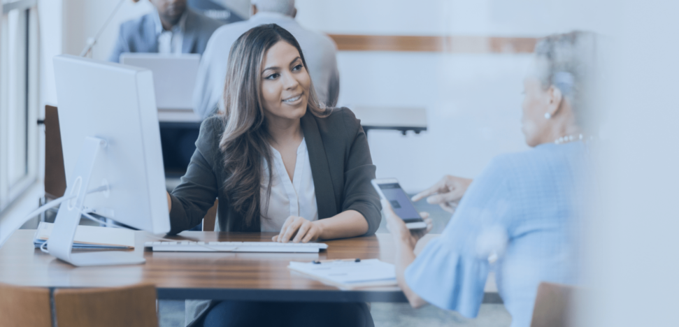 woman at desk with customer