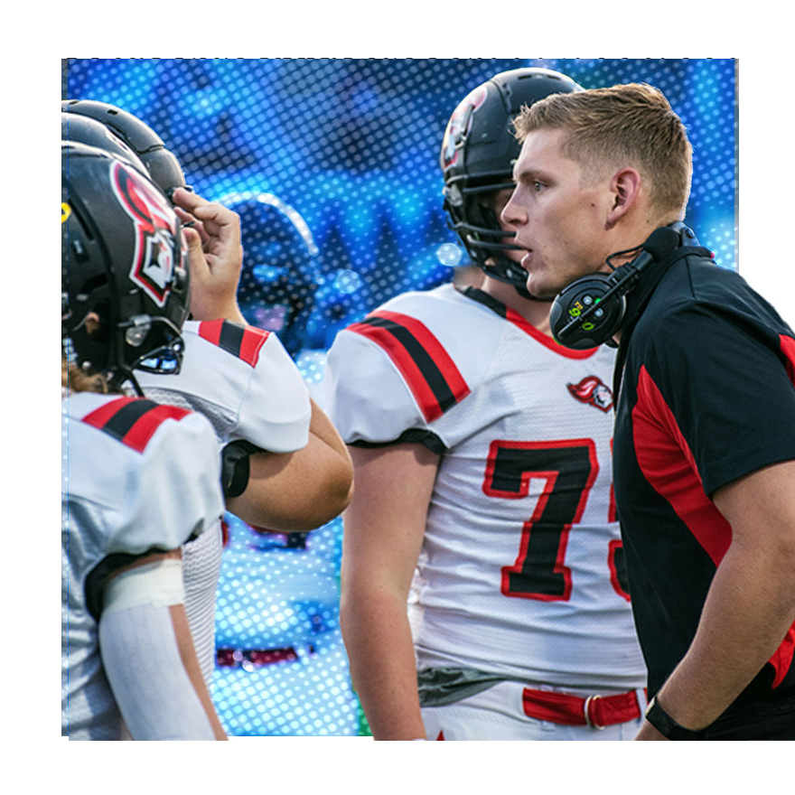 SNAP-RISE!-WEBSITE-HIGH-STAKES coach talking to footballlplayer