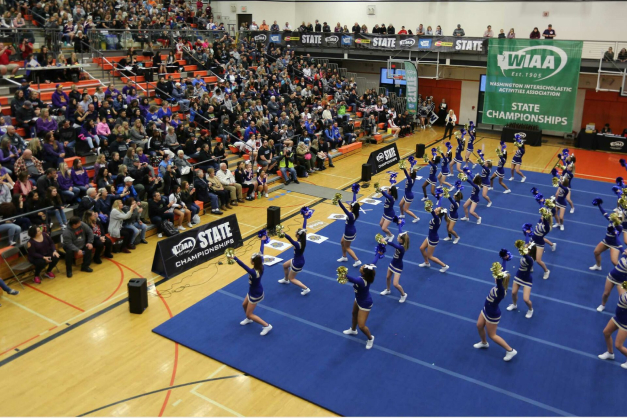 VantaPartner4-1536x1024.jpeg Cheerleading squad in an auditorium.