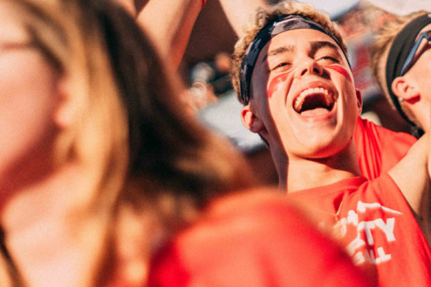 students cheering in a crowd