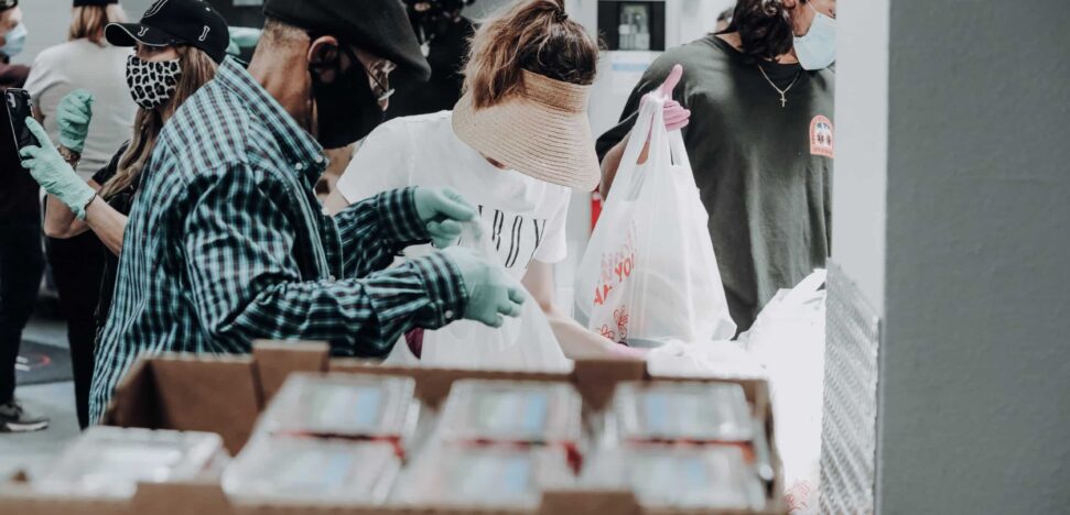 Volunteers packaging supplies